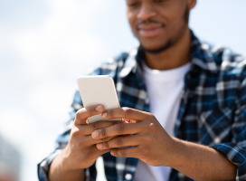 A close up image of someone holding a cell phone