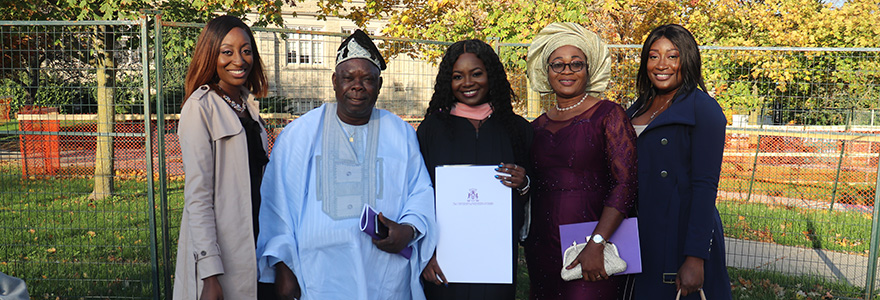 Family smiling with their graduate