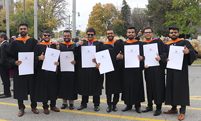 Group of graduates with degrees